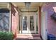 Charming front entrance with a brick facade, double doors, and sidelights at 2160 Kensington Gates Nw Dr, Kennesaw, GA 30152