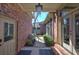 Welcoming front porch with a cozy bench, lush greenery, and a lantern-style light fixture at 2160 Kensington Gates Nw Dr, Kennesaw, GA 30152