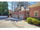 Attached brick garage with three bays and wide concrete driveway at 2160 Kensington Gates Nw Dr, Kennesaw, GA 30152