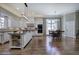 Open concept kitchen with an island, stainless steel appliances, a breakfast nook, and dark hardwood floors at 2160 Kensington Gates Nw Dr, Kennesaw, GA 30152