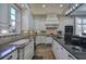 Stylish kitchen with a kitchen island, granite countertops, stainless steel appliances, and white cabinetry at 2160 Kensington Gates Nw Dr, Kennesaw, GA 30152