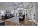 Open living room with fireplace, coffered ceiling, and hardwood floors at 2160 Kensington Gates Nw Dr, Kennesaw, GA 30152