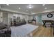 Spacious living room with wood floors and recreational game at 2160 Kensington Gates Nw Dr, Kennesaw, GA 30152