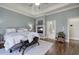 Main bedroom features a trey ceiling, fireplace, hardwood floors, and an ensuite bathroom at 2160 Kensington Gates Nw Dr, Kennesaw, GA 30152