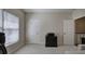 Well-lit office space with neutral carpet, a large window, and ample storage for a productive work environment at 2160 Kensington Gates Nw Dr, Kennesaw, GA 30152