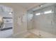 Modern bathroom with a glass shower and a view into the main bedroom at 264 Depot Landing Rd # 50, Auburn, GA 30011