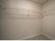 Empty walk-in closet with wire shelving ready to organize your wardrobe at 264 Depot Landing Rd # 50, Auburn, GA 30011