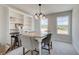 Dining area with built-in shelving, natural light, and granite table at 264 Depot Landing Rd # 50, Auburn, GA 30011