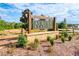 Wooden Auburn Station sign with a brick base and landscaped surroundings, welcoming visitors and residents at 264 Depot Landing Rd # 50, Auburn, GA 30011