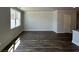 Bright living room with wood floors and a large window at 264 Depot Landing Rd # 50, Auburn, GA 30011