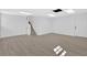 Unfinished basement with neutral vinyl floors, stairs, and a door at 3679 Mill Glen Dr, Douglasville, GA 30135