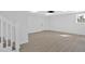 Unfinished basement with neutral vinyl floors, recessed lighting, and a staircase at 3679 Mill Glen Dr, Douglasville, GA 30135