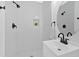 Modern bathroom featuring black fixtures, white subway tile, and a built-in niche at 3679 Mill Glen Dr, Douglasville, GA 30135