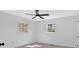 A bright bedroom featuring two windows and a ceiling fan at 3679 Mill Glen Dr, Douglasville, GA 30135