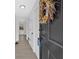 Inviting entryway with stylish black door, neutral walls, and modern light fixture at 3679 Mill Glen Dr, Douglasville, GA 30135