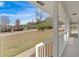 Covered front porch features white columns and railings, offering a serene outdoor space at 3679 Mill Glen Dr, Douglasville, GA 30135