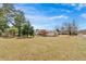 Charming single-story home with a spacious front yard and lovely landscaping at 3679 Mill Glen Dr, Douglasville, GA 30135