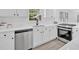 Updated kitchen with white cabinets, stainless steel appliances, and white subway tile backsplash at 3679 Mill Glen Dr, Douglasville, GA 30135