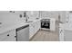 Modern kitchen features white cabinets, stainless steel appliances, and hardwood flooring at 3679 Mill Glen Dr, Douglasville, GA 30135
