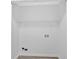 An empty, all-white laundry room with a shelf at 3679 Mill Glen Dr, Douglasville, GA 30135