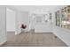 Open concept kitchen and living space with large windows and light-colored floors and walls at 3679 Mill Glen Dr, Douglasville, GA 30135