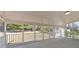 Covered patio with screened-in views of the lawn and trees at 3679 Mill Glen Dr, Douglasville, GA 30135