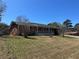 Quaint single-story brick home featuring a covered front porch, set on a spacious lot at 726 Shoreline Se Trl, Conyers, GA 30094