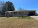 Charming single-story brick home with a covered porch and a convenient carport at 726 Shoreline Se Trl, Conyers, GA 30094