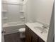 Bathroom with a shower-tub combo and a modern vanity at 220 Bloomfield Cir, Canton, GA 30114