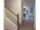 Inviting entryway featuring a staircase and wood flooring at 220 Bloomfield Cir, Canton, GA 30114