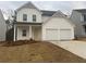 Charming two-story home with a two-car garage and a welcoming front porch at 220 Bloomfield Cir, Canton, GA 30114