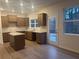 Modern kitchen with stainless steel appliances, granite countertops, and a view to the backyard at 220 Bloomfield Cir, Canton, GA 30114