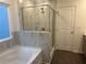 Relaxing main bathroom with a soaking tub and a separate shower at 220 Bloomfield Cir, Canton, GA 30114