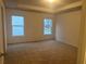 Calm and spacious main bedroom with carpeted floors at 220 Bloomfield Cir, Canton, GA 30114
