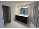 Bathroom featuring a double sink vanity, white countertops, and walk-in glass shower at 254 Depot Landing Rd # 55, Auburn, GA 30011