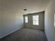 Bedroom featuring carpet, neutral walls, and a double window at 254 Depot Landing Rd # 55, Auburn, GA 30011