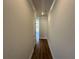 Bright hallway featuring hardwood floors and neutral paint, creating a welcoming entrance at 254 Depot Landing Rd # 55, Auburn, GA 30011