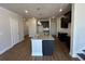 Spacious kitchen featuring a granite island with a stainless steel sink and dark wood cabinets at 254 Depot Landing Rd # 55, Auburn, GA 30011
