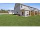 Spacious backyard with a covered patio, perfect for outdoor dining and entertaining at 935 Elwood St, Dacula, GA 30019