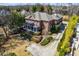 Expansive home with mature landscaping, featuring a circular driveway, and well manicured lawn at 1364 Manget Way, Dunwoody, GA 30338