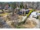 Expansive estate featuring lush landscaping, a main house with a covered porch, and a detached structure with ample parking at 1364 Manget Way, Dunwoody, GA 30338