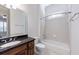 Clean bathroom with a granite countertop vanity and a shower-tub combination at 1364 Manget Way, Dunwoody, GA 30338