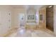Bright bathroom with tiled flooring, a soaking tub with tile surround, and a glass-enclosed shower at 1364 Manget Way, Dunwoody, GA 30338