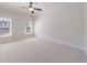 Spacious bedroom featuring two windows and a ceiling fan at 1364 Manget Way, Dunwoody, GA 30338