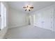 Airy bedroom with plantation shutters, ample closet space, and neutral carpet at 1364 Manget Way, Dunwoody, GA 30338