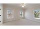 Bright bedroom with neutral carpet and multiple windows offering natural light at 1364 Manget Way, Dunwoody, GA 30338