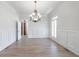 Formal dining room with hardwood floors, wainscoting, chandelier, and ample natural light at 1364 Manget Way, Dunwoody, GA 30338