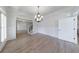 Elegant dining room featuring wainscoting, hardwood floors, and a decorative chandelier at 1364 Manget Way, Dunwoody, GA 30338
