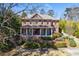Charming brick home with a inviting front porch and beautifully landscaped front yard at 1364 Manget Way, Dunwoody, GA 30338