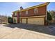 Spacious three-car garage attached to a classic brick home with well-maintained landscaping at 1364 Manget Way, Dunwoody, GA 30338